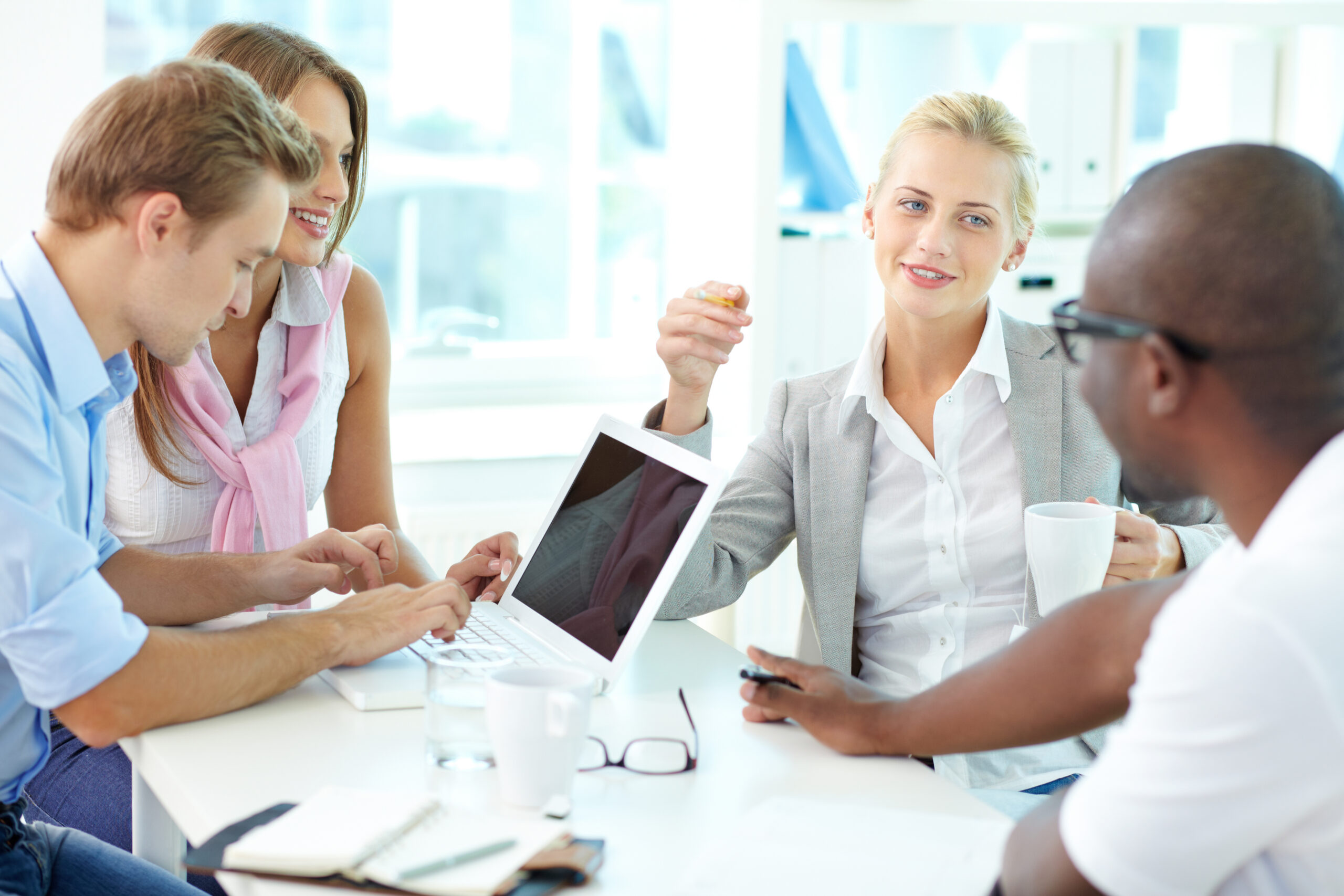 Diverse group of researchers collaborating in a modern lab setting